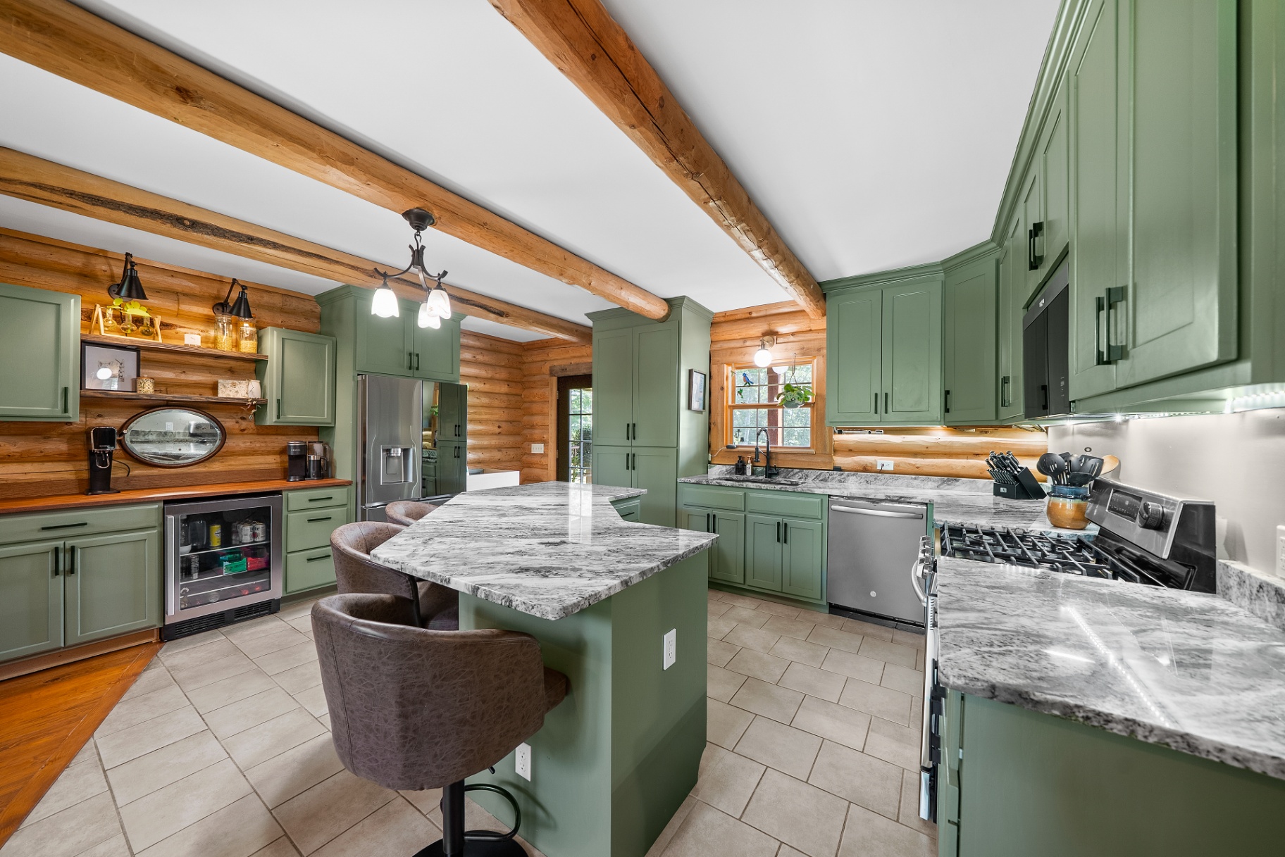 Renovated kitchen with sage cabinetry
